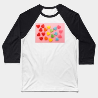 Heart-shaped colorful candy arranged in rainbow colors, on a pink background Baseball T-Shirt